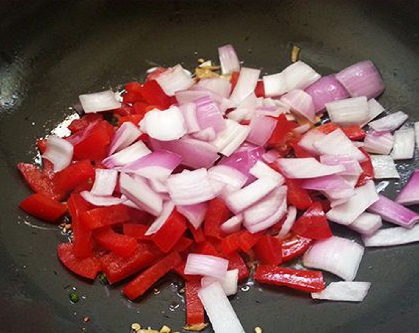 step 7 Add Onion (1) and Red Chili Peppers (2). Saute until the onion becomes translucent.