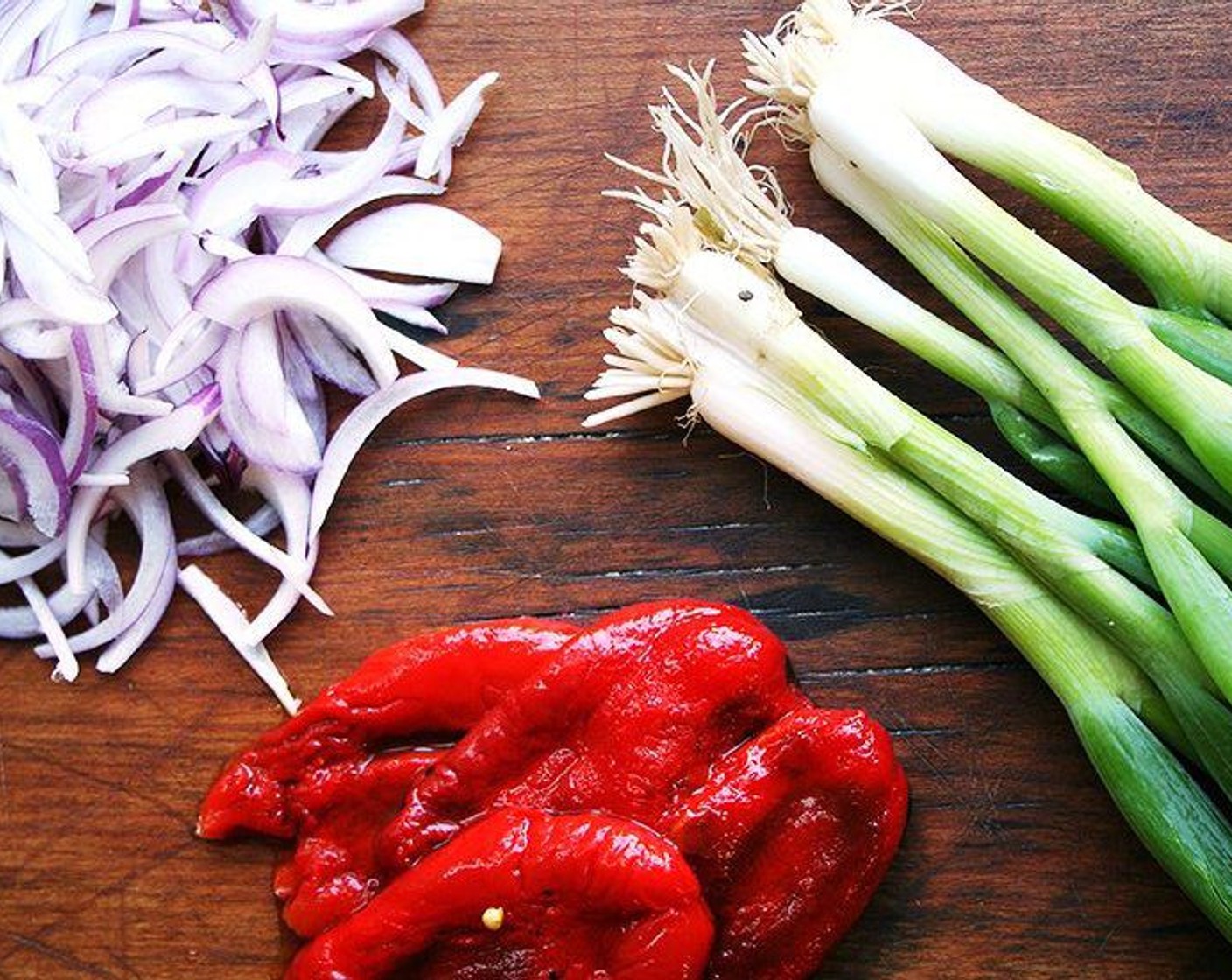 step 12 Add Roasted Red Pepper Strips (1 cup), Red Onion (1/2 cup), Scallion (1 bunch) and Shelled Edamame (1 cup) to the bowl.