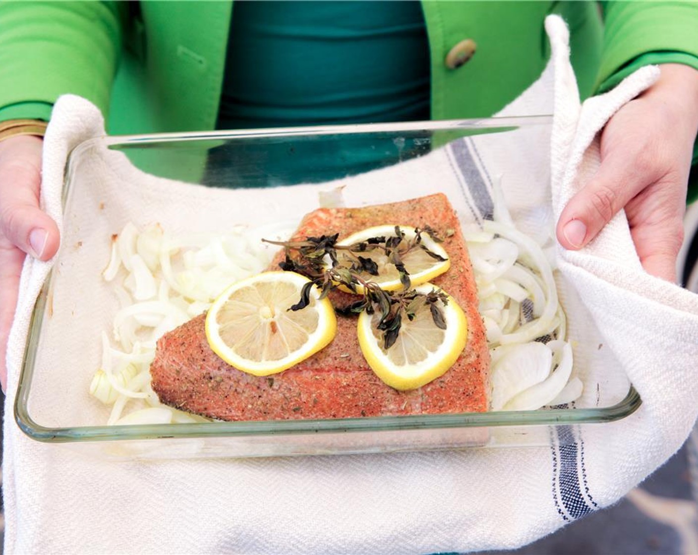 step 8 Place the dish with the salmon on the bottom rack of the oven. Allow to bake until the salmon is just fully cooked, approximately 15-20 minutes.