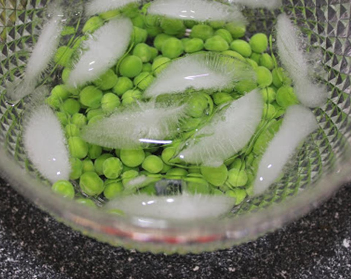 step 3 Strain and transfer to a small bowl of ice water to shock them. Strain again.