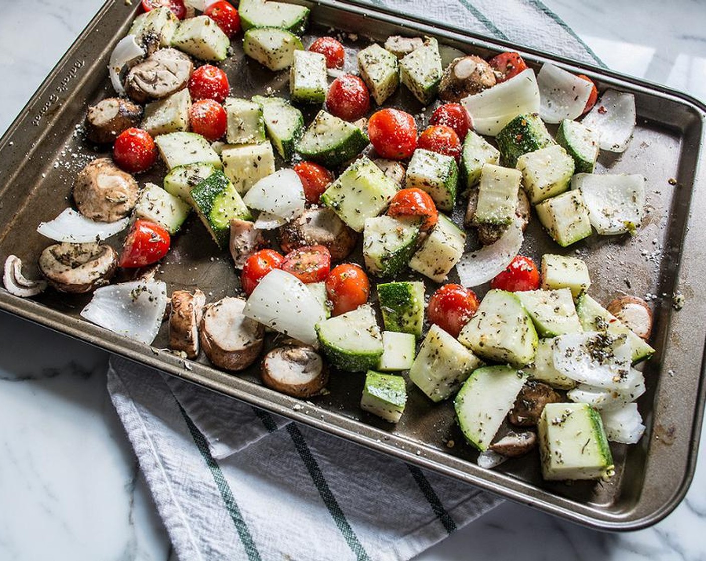 step 4 Mix to combine, then drop spoonfuls of seasoned oil over prepped veggies, use hands to toss and coat all veggies.