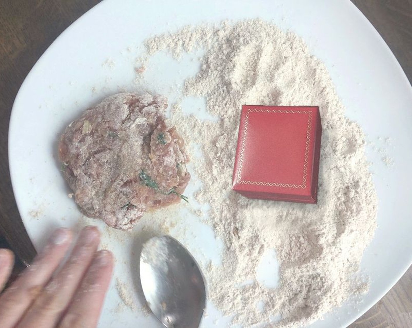 step 17 Create patties with the remaining meat mixture, coat with flour and set aside. Next, open the red box.