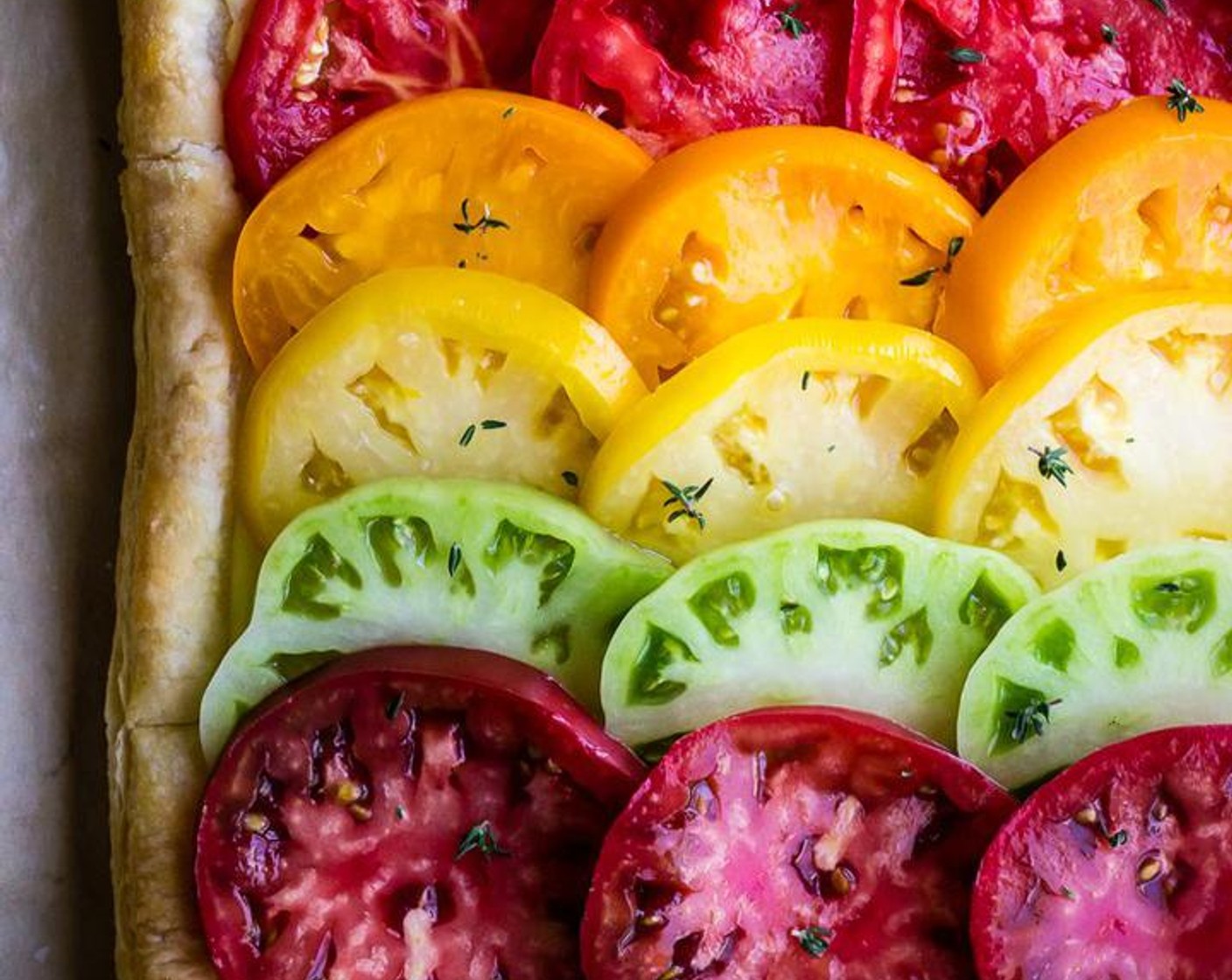 step 5 Remove pastry from oven and let cool at room temperature for about 10 minutes top pastry off with tomato slices and sprinkle tomatoes with flaky salt and fresh thyme leaves.