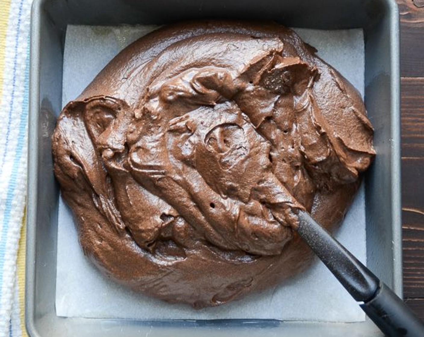 step 7 Transfer the batter into the prepared pan and use a spatula to spread it out evenly.