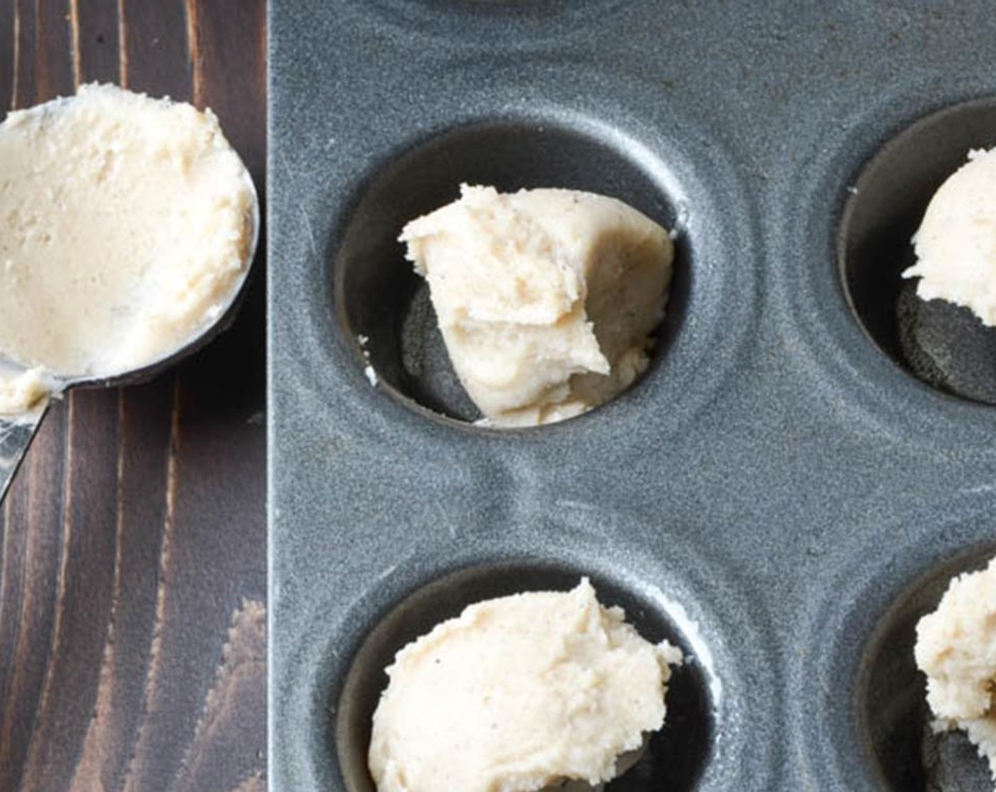step 7 Scoop 1 level tablespoon of dough into each muffin tin. Use floured dough tamper, to tamp the dough into the muffin tin to form little shells. Refrigerate for 10-15 minutes until chilled.
