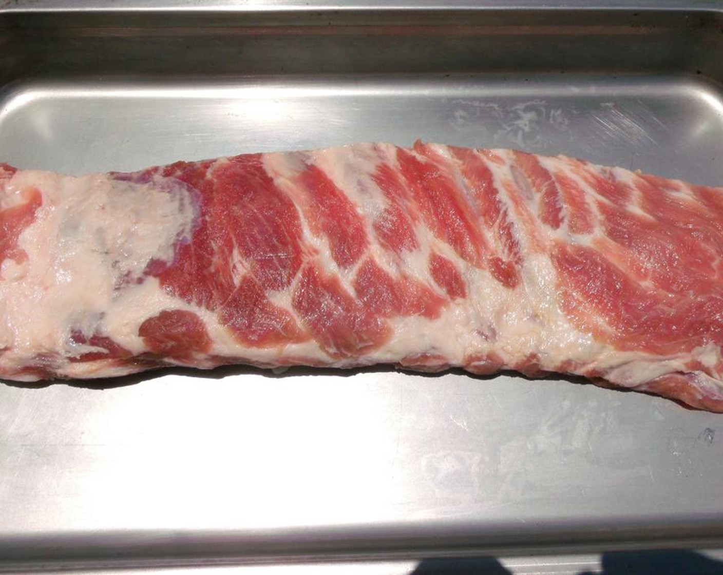 step 2 Season Pork Ribs (1 slab) with Kosher Salt (to taste) on both sides.