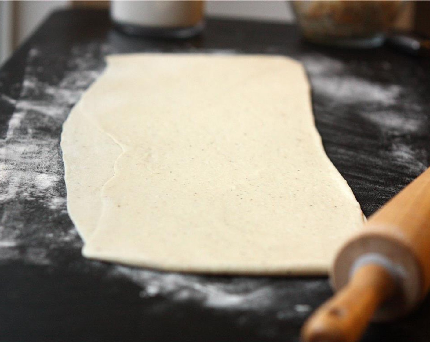 step 8 Remove dough from bowl and roll out on a floured surface into a long, narrow rectangle about 8-by-24-inches in size.