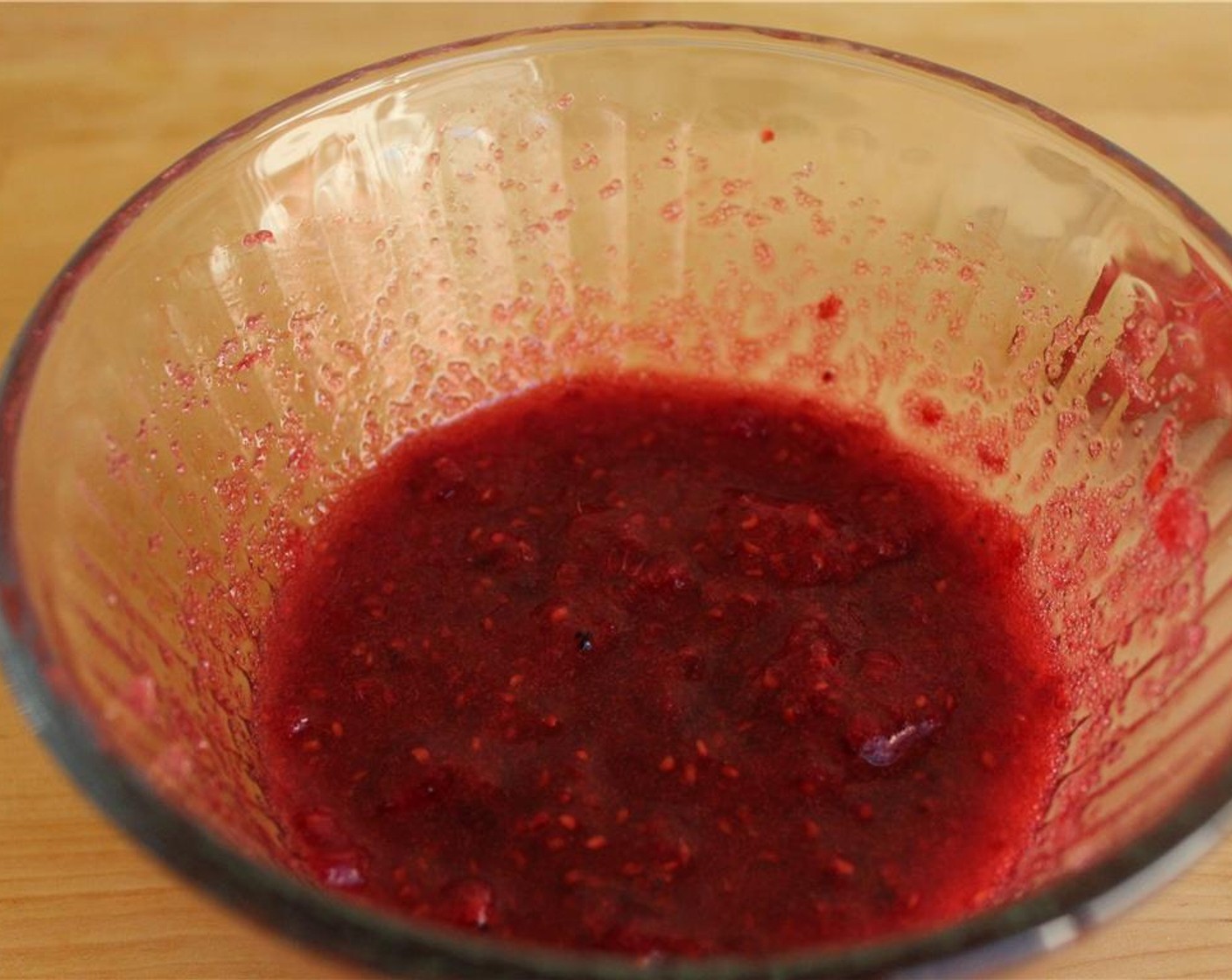 step 1 Rinse and dry the Fresh Raspberries (2 cups) then muddle with the Granulated Sugar (1 cup) in a container that has an airtight lid. Let sit in a cool, dark olace for 2-3 days.