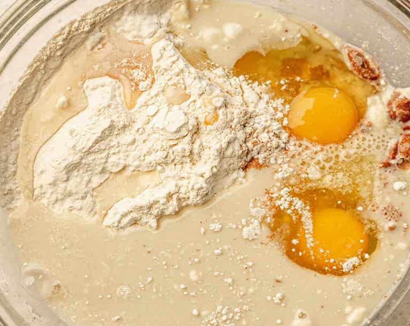 step 1 Add White Whole Wheat Flour (1 1/2 cups), Baking Powder (1 Tbsp), Simply Organic Cinnamon, Ground (1 tsp), Eggland's Best Classic Eggs (2), and Oat Milk (1 cup) to a large bowl. Whisk until combined and the batter is smooth.