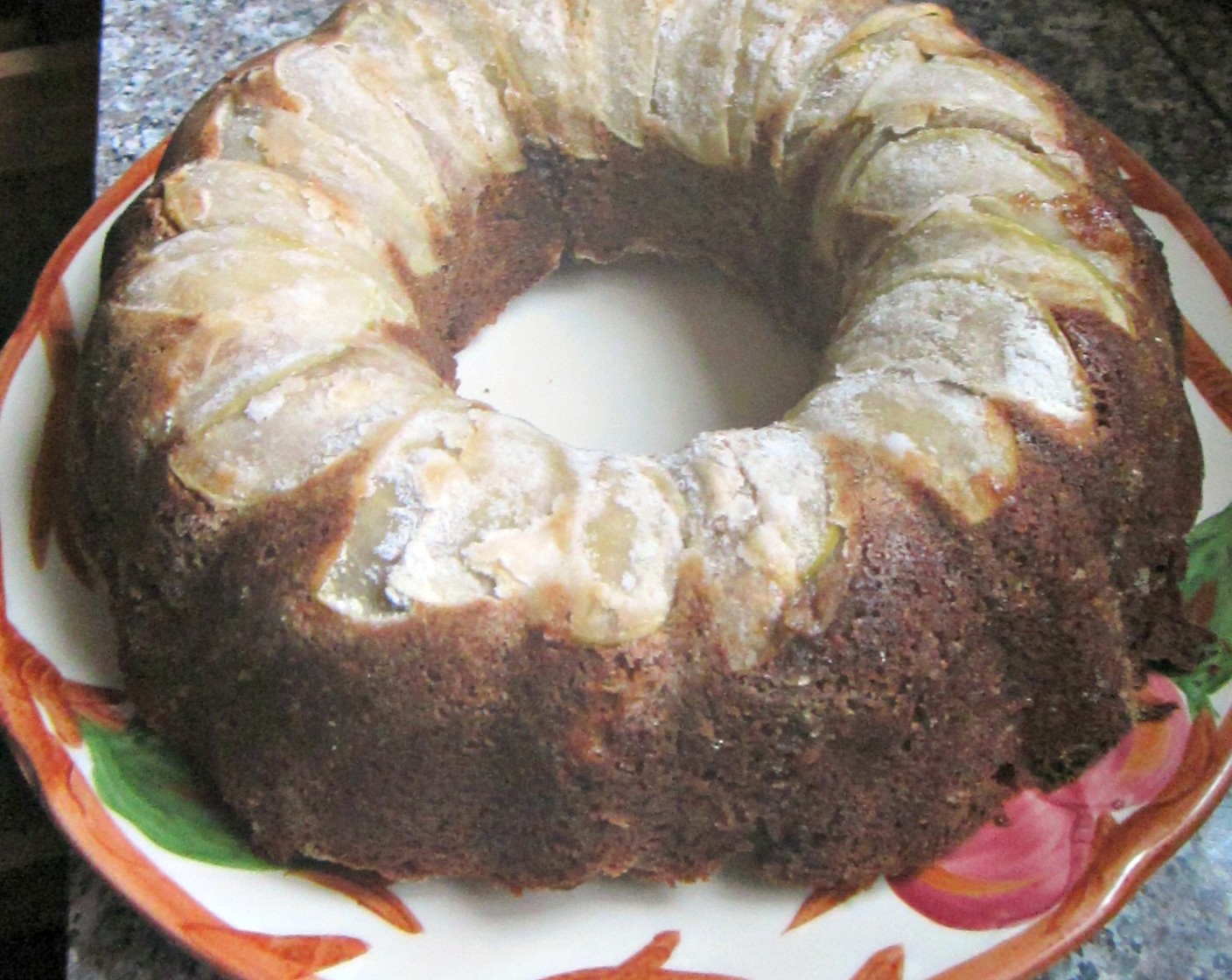 step 15 Once cake is cooked, allow it to cool for 10 minutes. To remove the cake from its pan, place a plate upside down on top of the bundt pan, then, holding the bottom of the bundt pan and the bottom of the plate, invert the pan and plate.