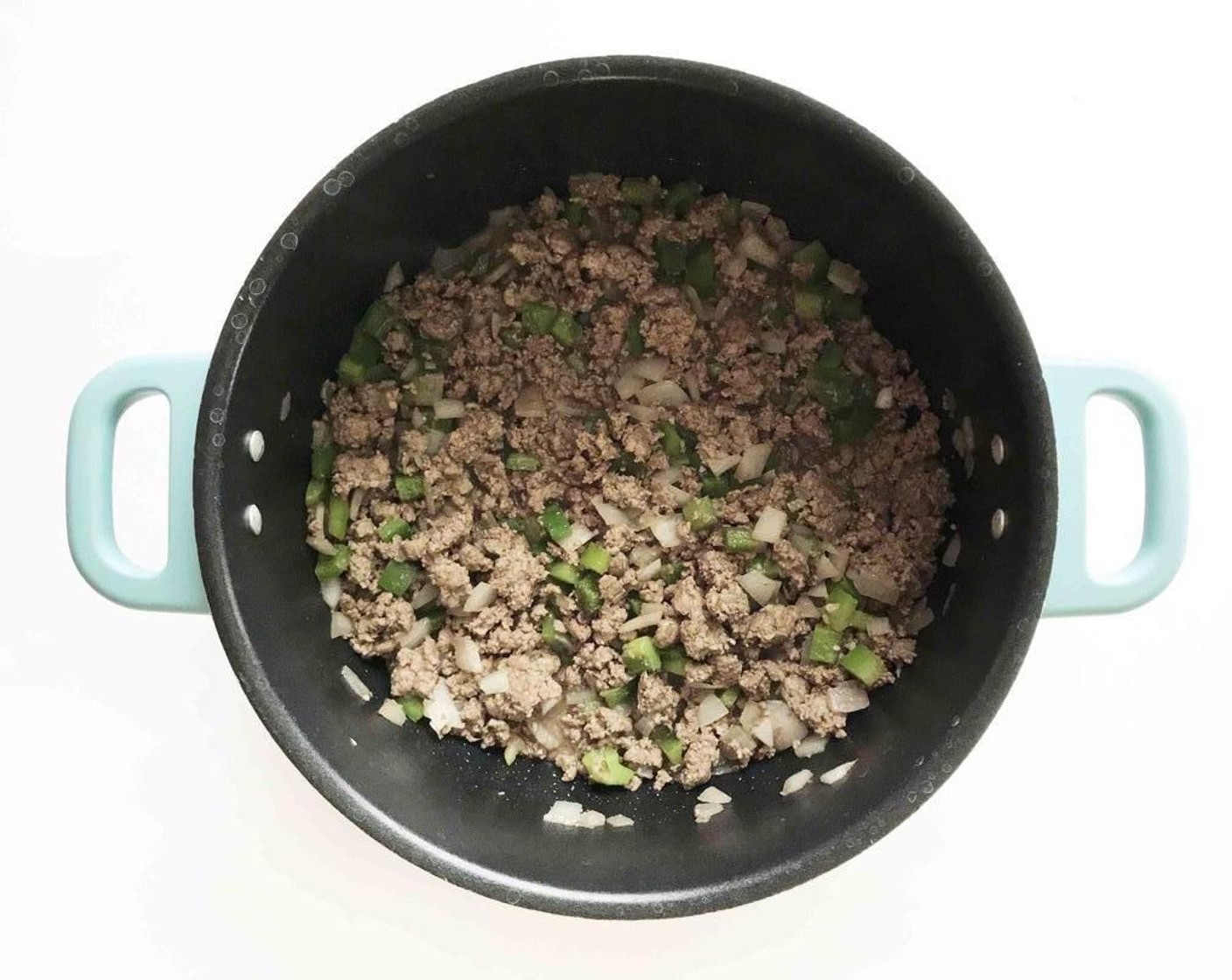 step 4 Once the beans are nearly done, brown the Extra Lean Ground Beef (1 lb), White Onion (1), Green Bell Pepper (1), and Jalapeño Pepper (1) in a large pot or stockpot.