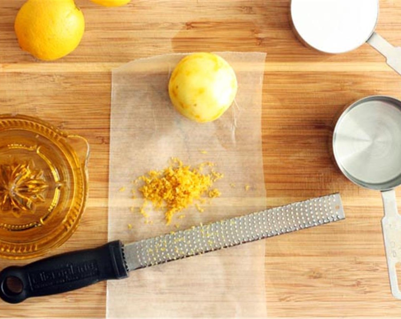 step 1 Scrub all Lemons (5) clean, then pat dry with a dry towel or tissues. Use a hand grater or lemon grater to zest the lemons.