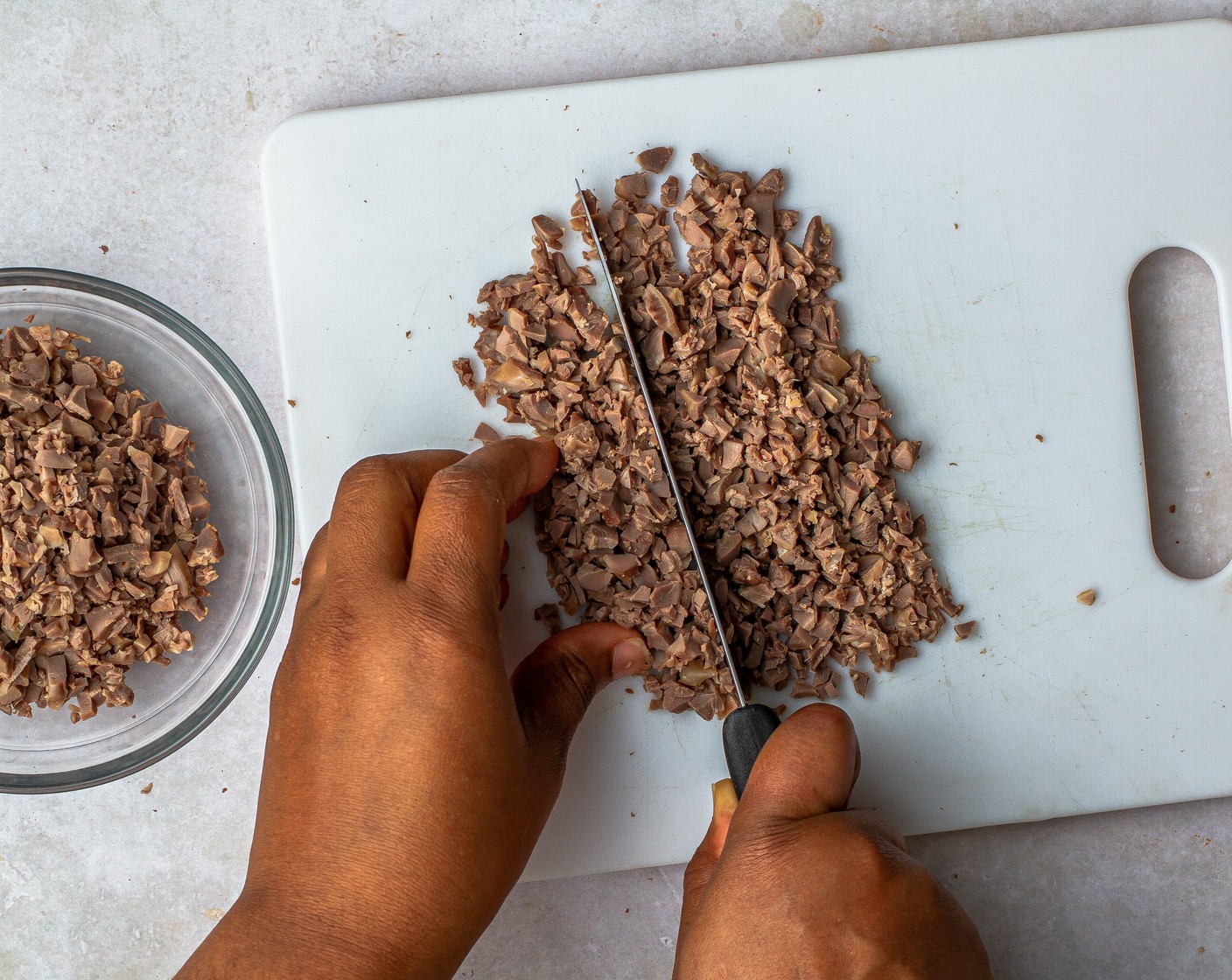 step 2 Cut the gizzards from the tough sinew, then chop the gizzards until they resemble ground meat. You can also chop them in a food processor. Set aside.