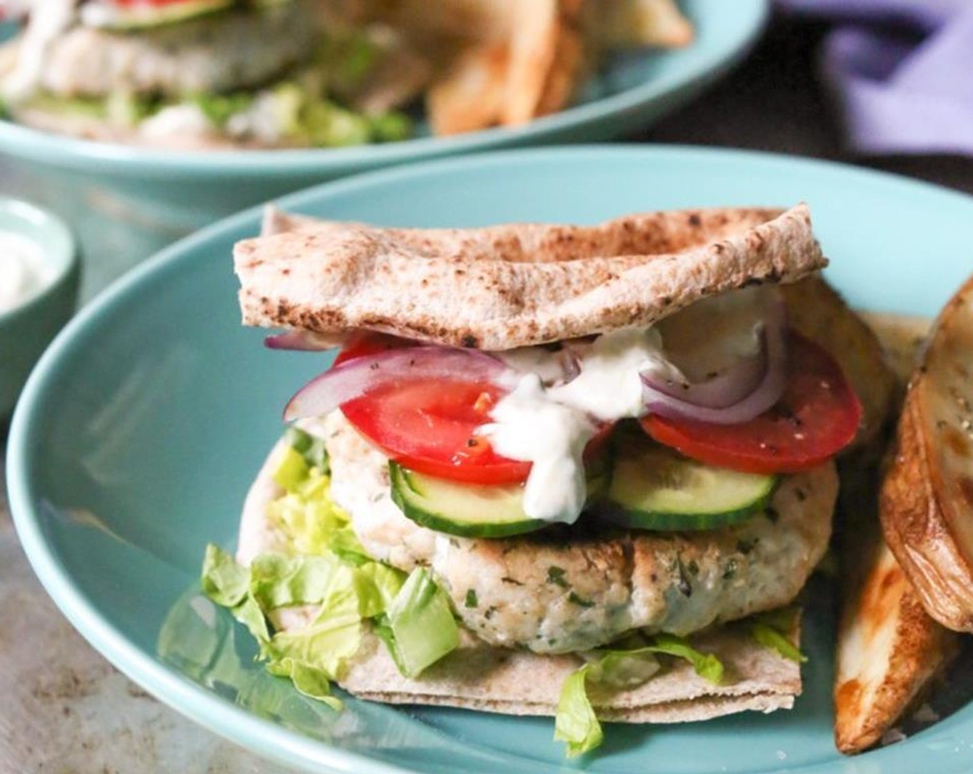 step 11 Garnish with thinly sliced English Cucumber (1/4), Plum Tomato (1) that have been sliced into rounds and Red Onion (1/2) and finish with extra yogurt sauce. Add everything together and serve immediately. Enjoy!