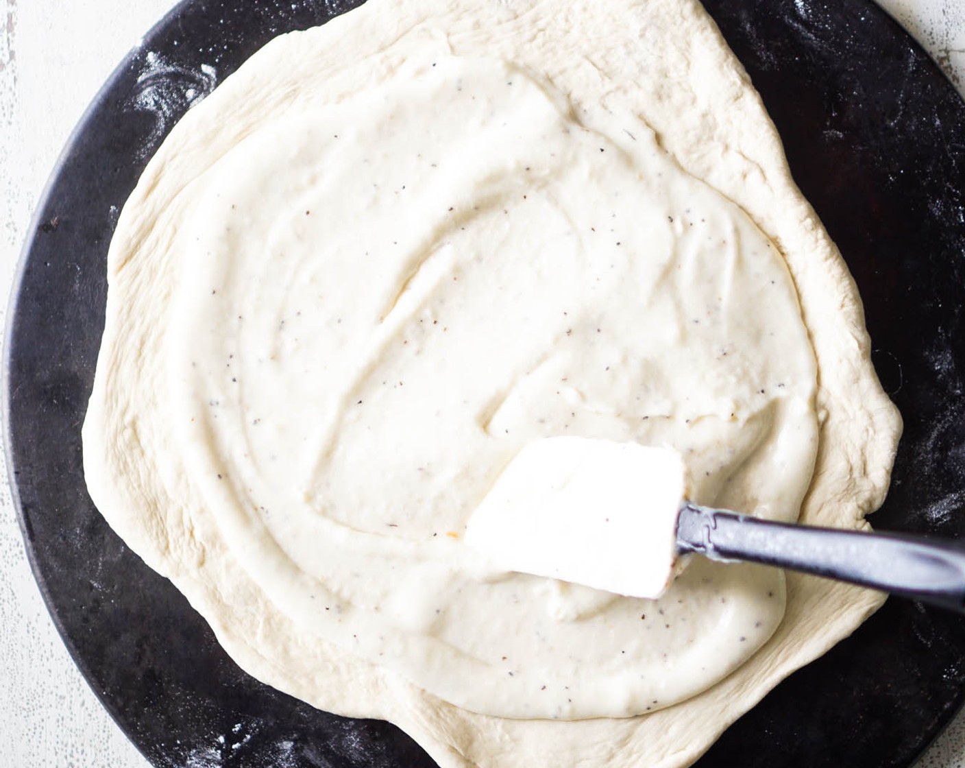 step 8 Prepare the Pizza Dough (1) by rolling it into your desired shape and placing on a pizza pan.