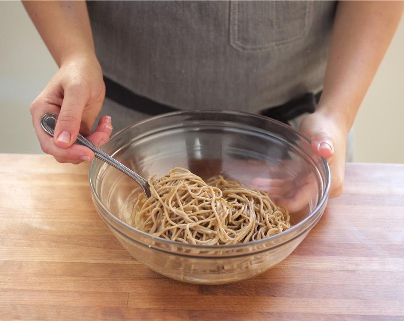 step 6 Pour half of the dressing over the noodles and toss well until combined. Place in the refrigerator to cool.