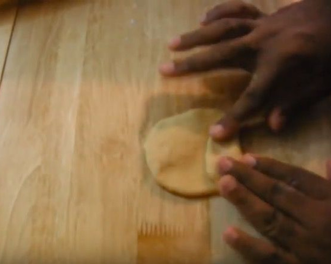 step 5 Fold both ends of each piece of dough in towards the center, then roll it out again.