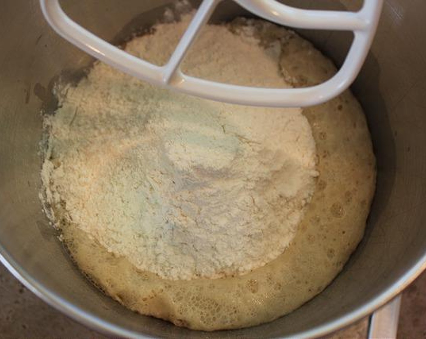 step 5 Add in the proofed Yeast Mix to the stand mixer bowl.