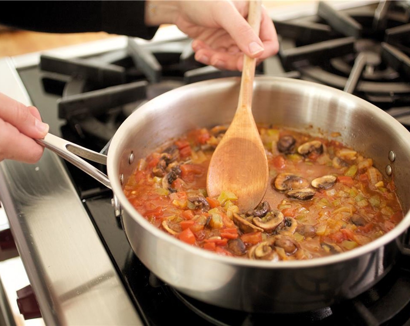 step 15 Add reserved mussel broth, Tomato Paste (2 Tbsp), one cup of water, Vegetable Base (1 pckg), Salt (1/2 tsp), and Ground Black Pepper (1/4 tsp). Cook for fifteen minutes.