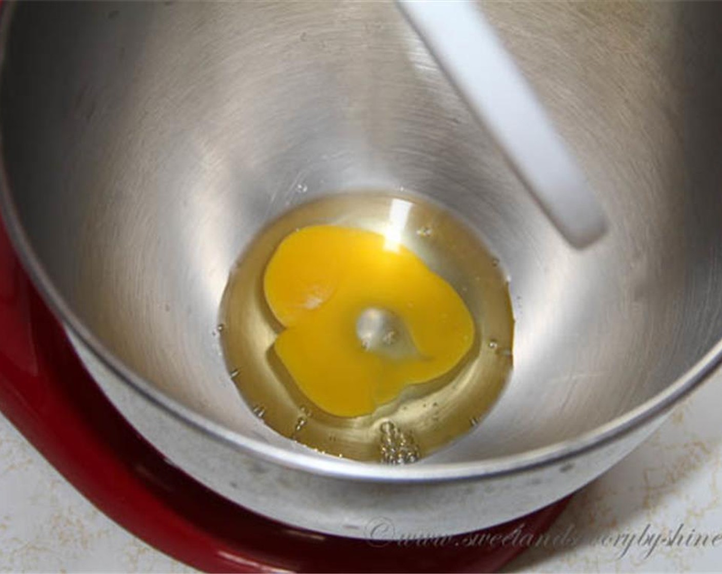 step 3 In a large mixing bowl, beat the Egg (1), Vegetable Oil (1/2 cup), Vanilla Extract (1 tsp), Buttermilk (3/4 cup) and Red Food Coloring (1 Tbsp) until smooth.