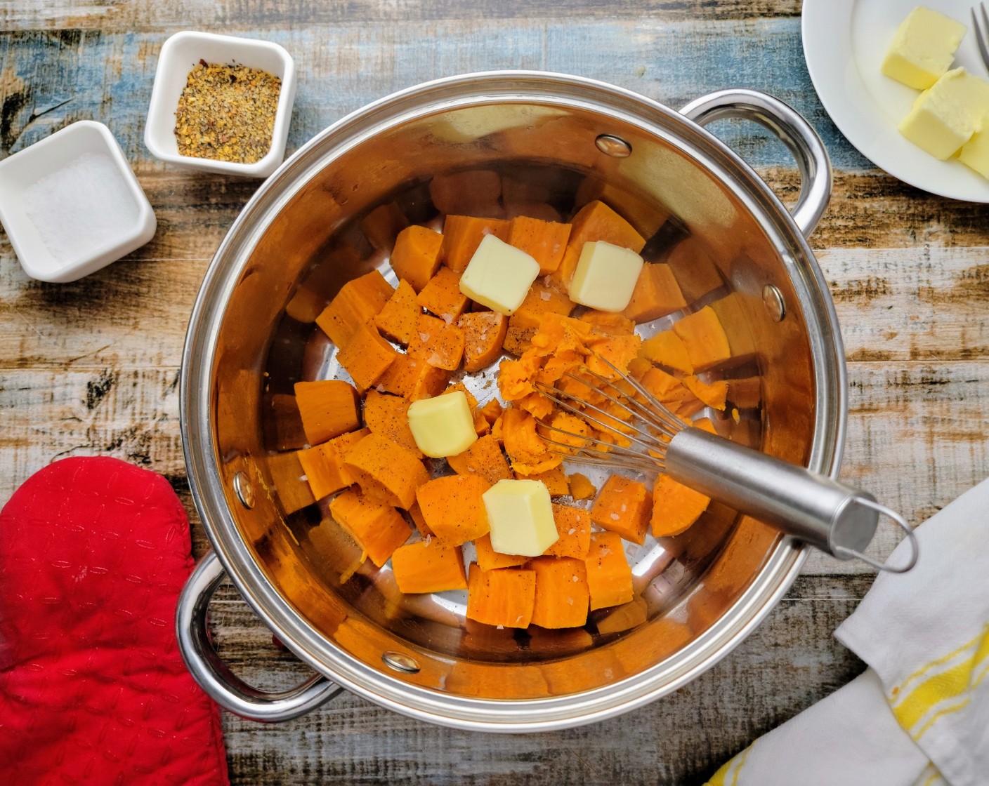 step 9 Drain the cooked sweet potatoes and add them back into the pot. Add in the Butter (4 Tbsp), salt, and pepper and mash the potatoes with a masher or a fork until mostly smooth, but with a few small chunks remaining
