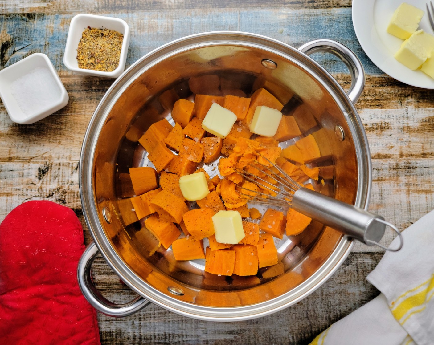 step 9 Drain the cooked sweet potatoes and add them back into the pot. Add in the Butter (1/4 cup), salt, and pepper and mash the potatoes with a masher or a fork until mostly smooth, but with a few small chunks remaining