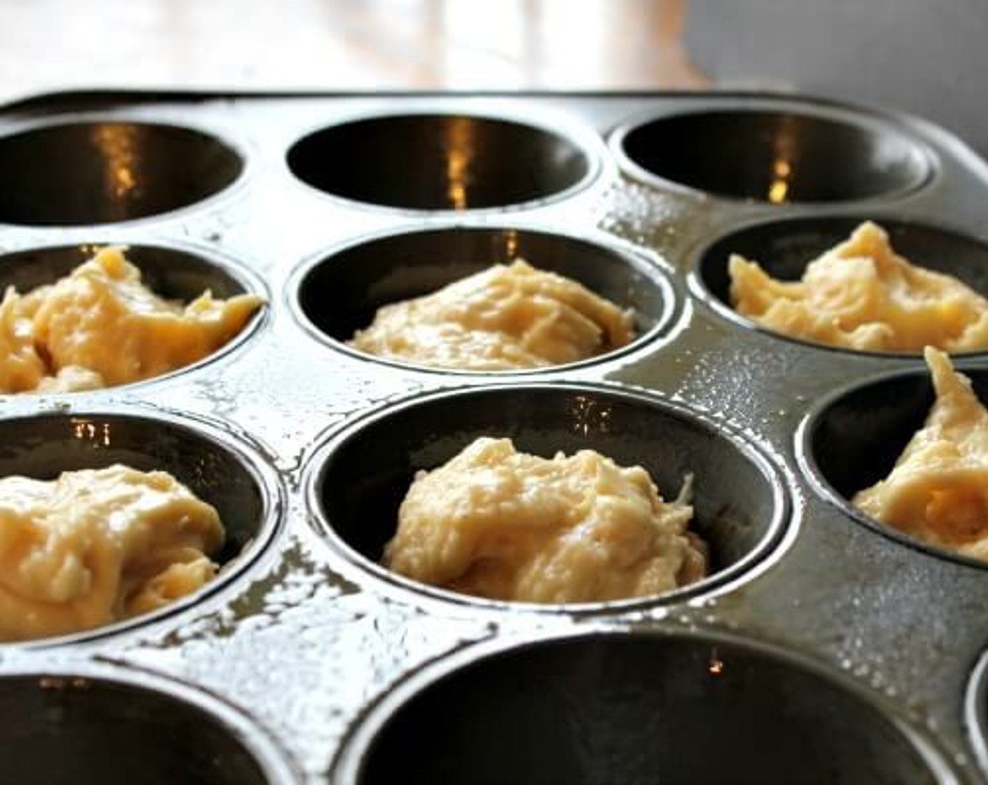 step 7 Using a spoon or ice cream scoop, place the batter into the prepared muffin pan. This recipe will make 6. Fill each muffin cup 3/4 full. Bake for 14 minutes or until a toothpick comes out clean.