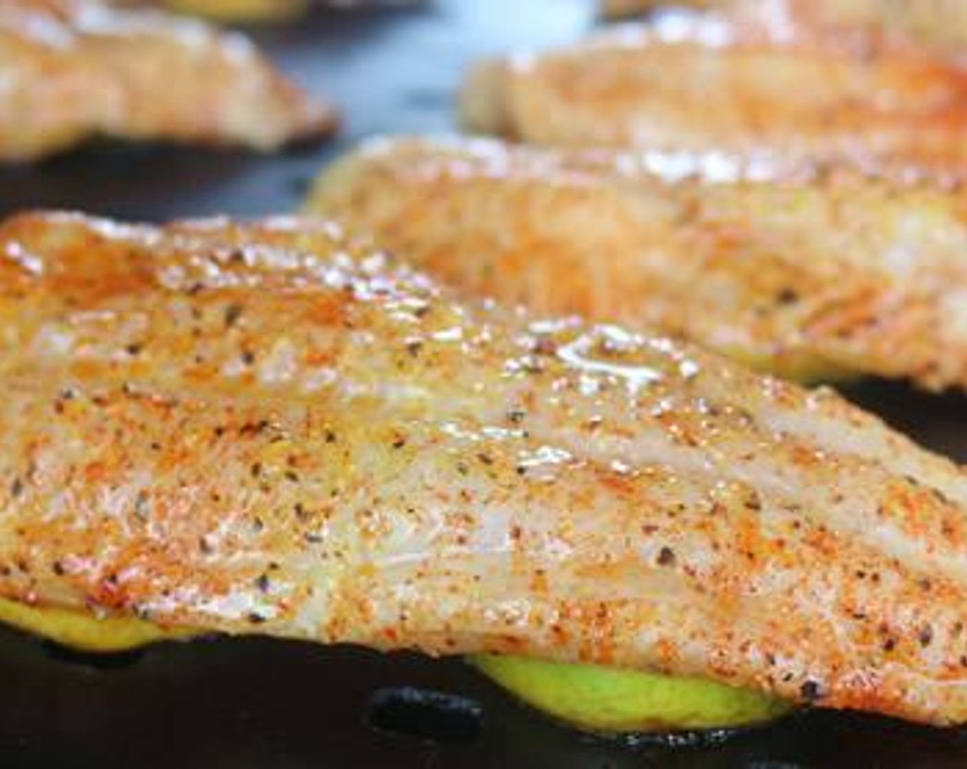 step 4 For each piece of catfish lay 2-3 Lemon/Lime slices on the grill surface and top with a filet.