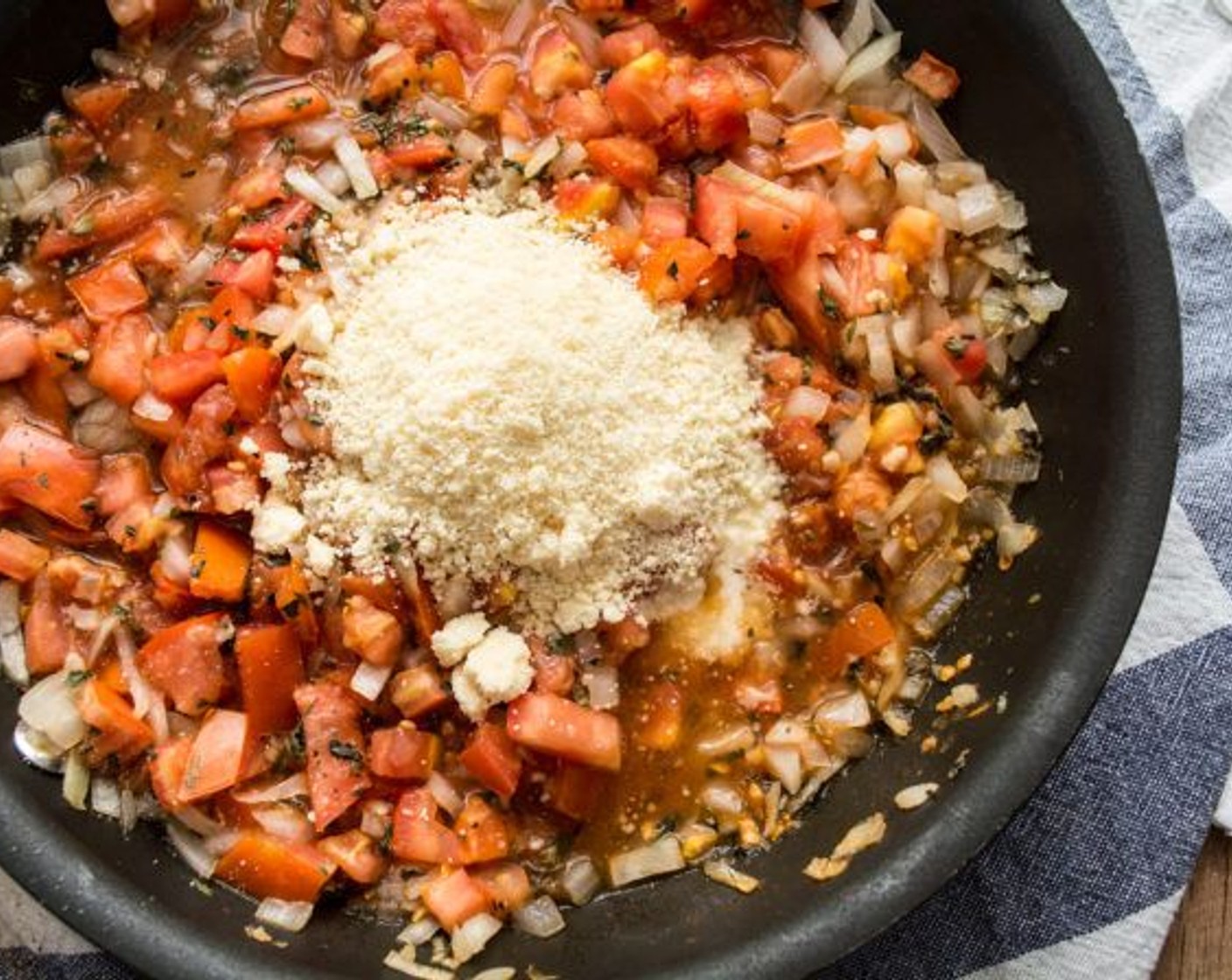 step 10 Remove onion and tomato mixture from heat, then stir in Parmesan Cheese (1/4 cup).