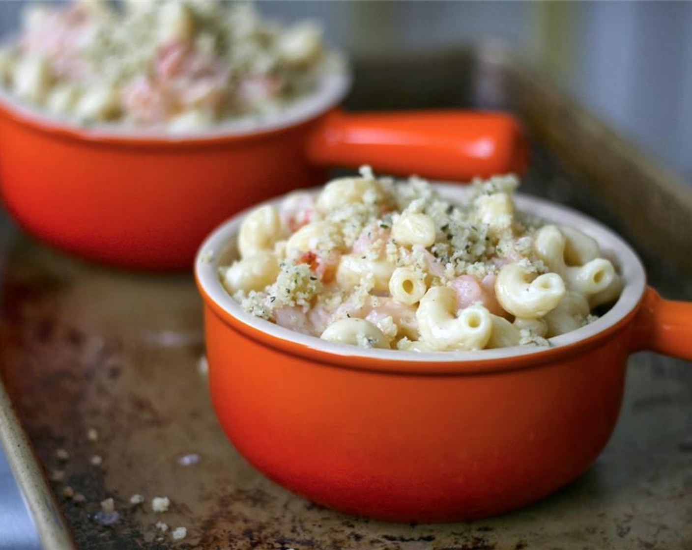 step 10 Transfer pasta to 2-quart baking dish or individual serving dishes such as ramekins, French onion soup bowls, or souffle pans. Sprinkle with bread crumbs and bake for 25 to 30 minutes or until browned on top and bubbling throughout.