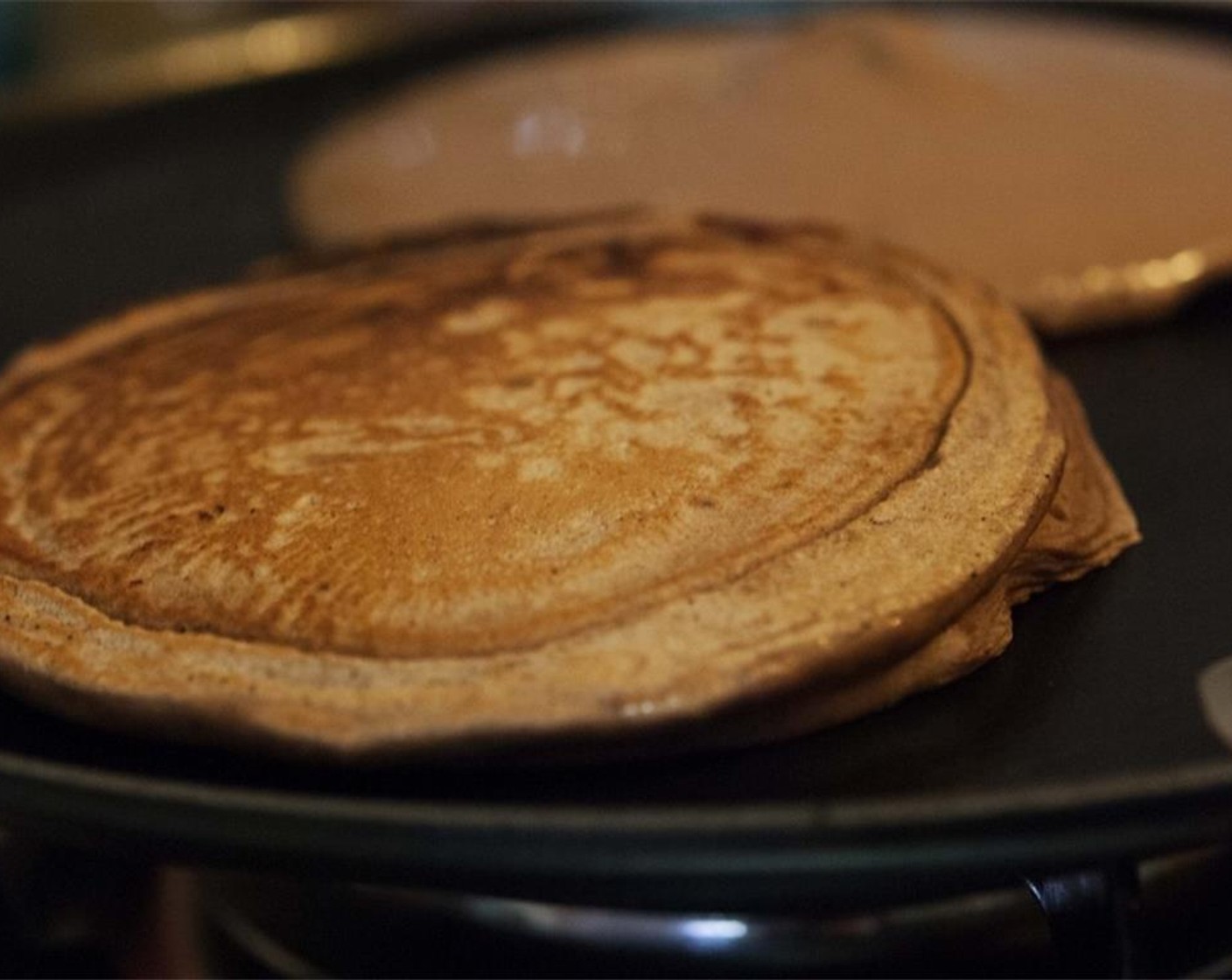 step 8 When the batter starts to bubble on one side, flip your pancake and cook for approximately one more minute until done. Remove from the pan, and place on a plate. Continue with the remaining batter. You should get about 4-5 pancakes.