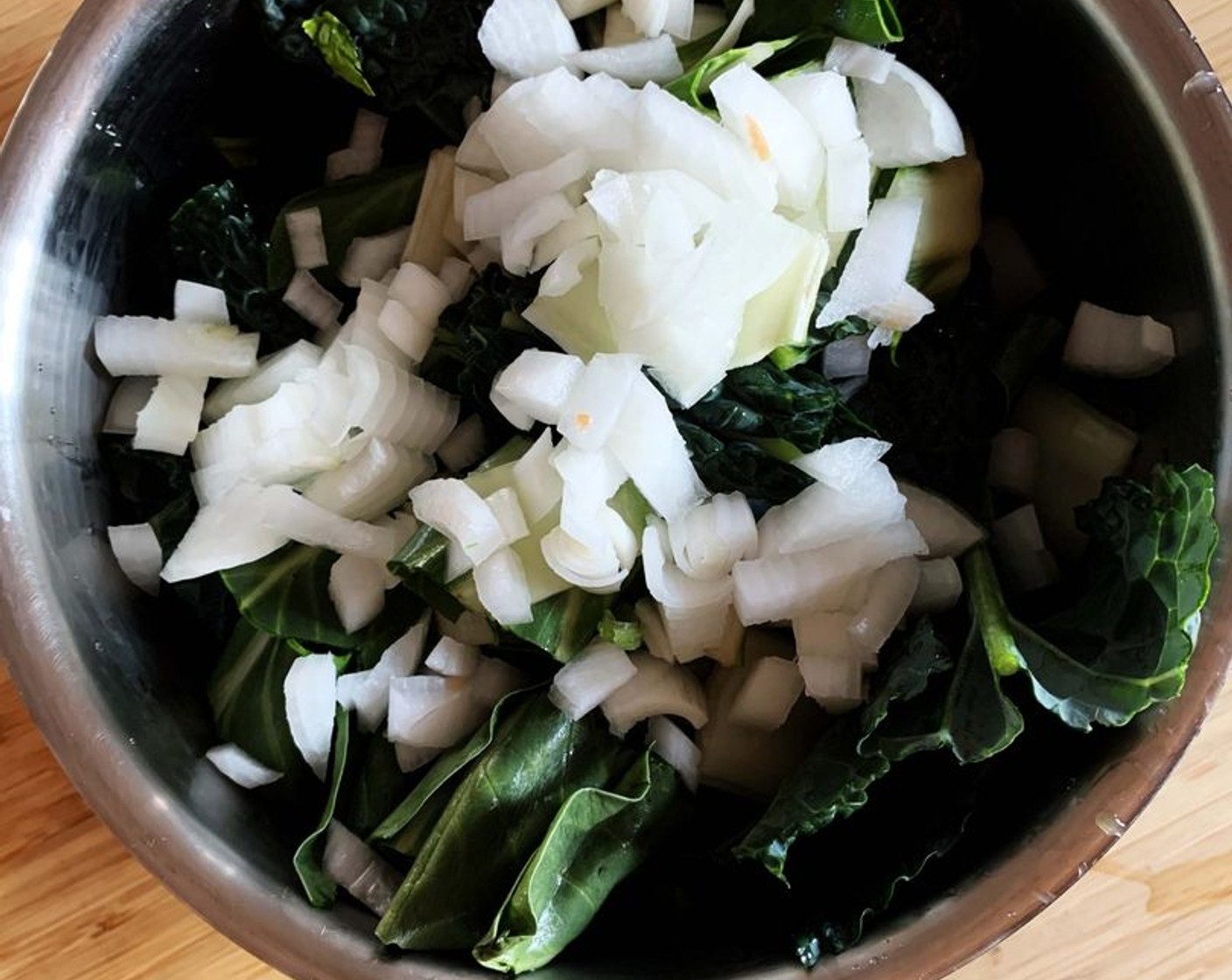 step 1 Place Tuscan Kale (3 cups), Carrot (1), Zucchini (1), Chard (1 handful), Black Garlic (2 cloves), Celery (4 Tbsp), Onion (1), Broccoli (1 cup), and Fresh Parsley (1 handful) into a large soup pot.