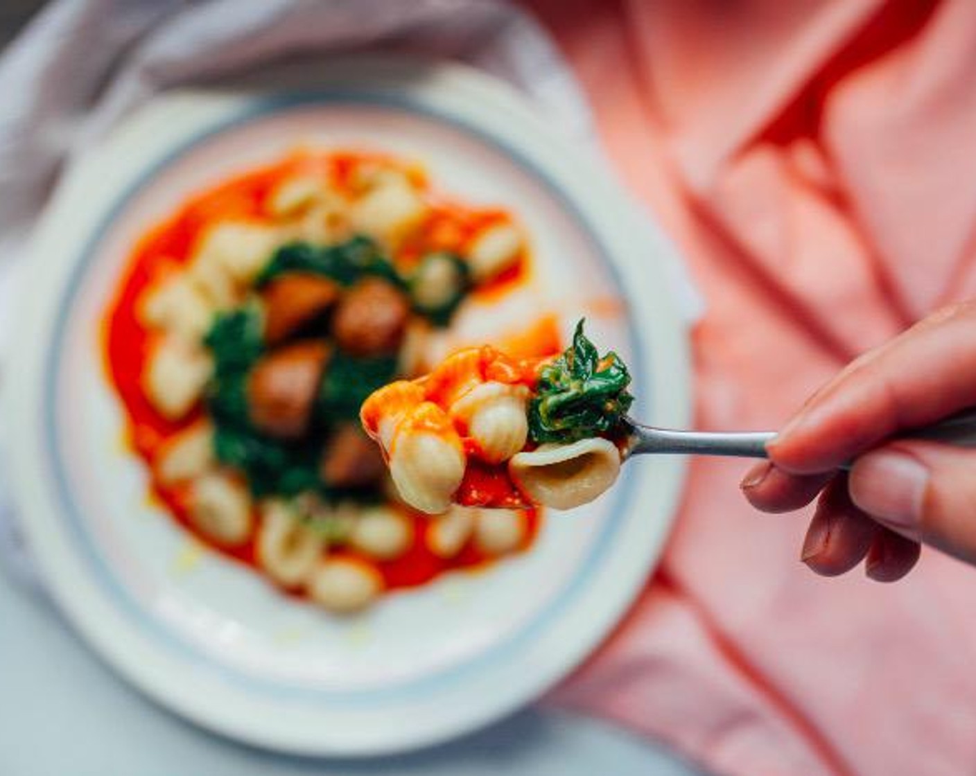 step 6 To plate, add a few spoonfuls of vodka sauce to your plate and top with pasta, spinach, and meatballs. Serve and enjoy!