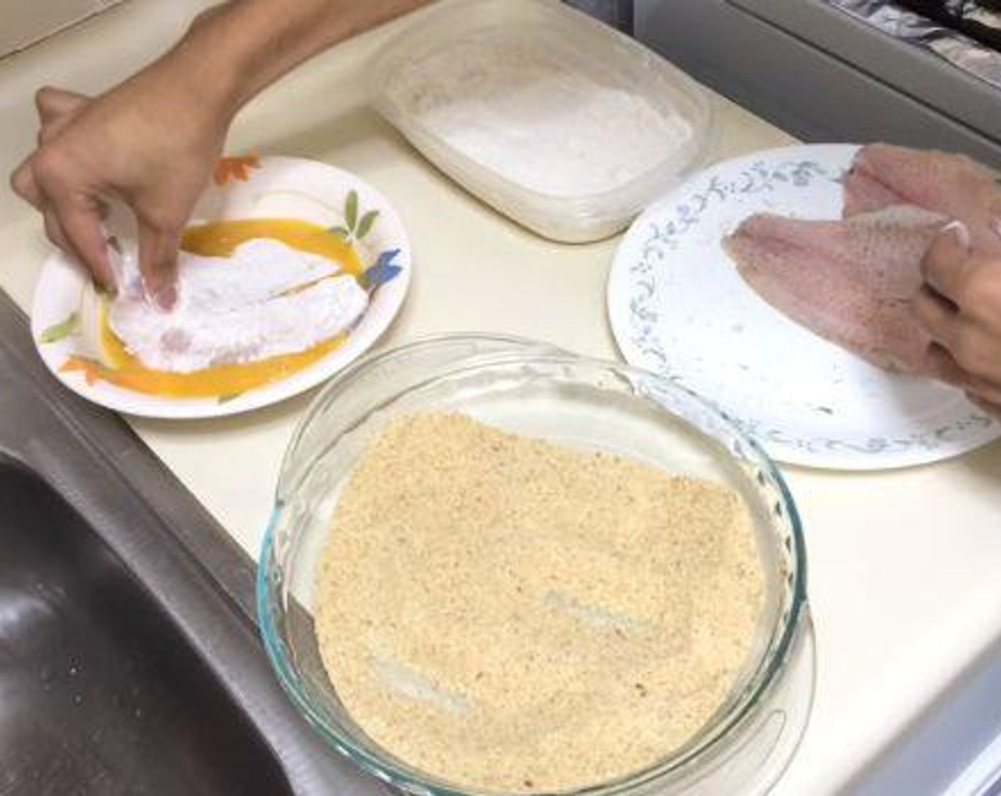 step 3 Season the Tilapia Fillets (3) with Salt (to taste) and Ground Black Pepper (to taste) on both sides. Take each filet, put it in the flour mixture, then the beaten Eggs (2), and finally the breadcrumbs mixture.