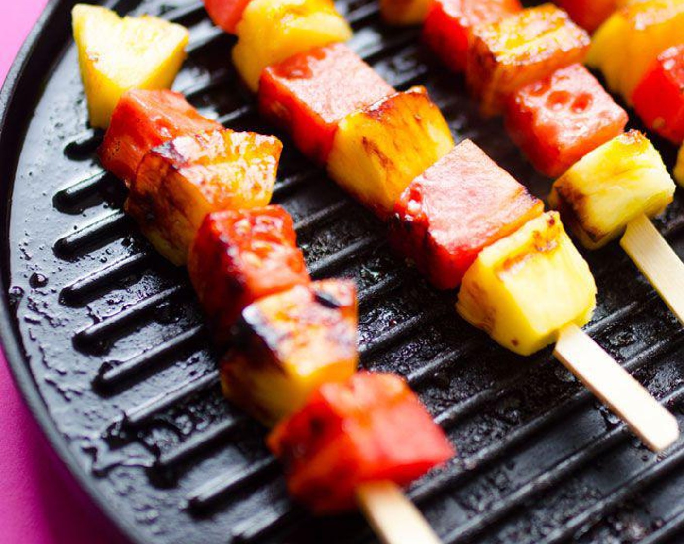 step 2 Combine Honey (2 Tbsp) and juice from Lime (1/2) then brush onto fruit. Grill skewers on the grill or on a medium-high heat stovetop grill pan until they begin to brown and caramelize.