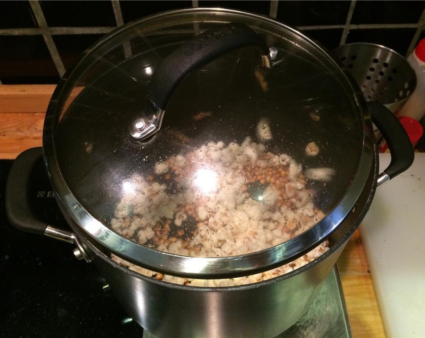step 7 As the kernels start to pot, gently shake the pot back and forth over the heat to ensure even heating.