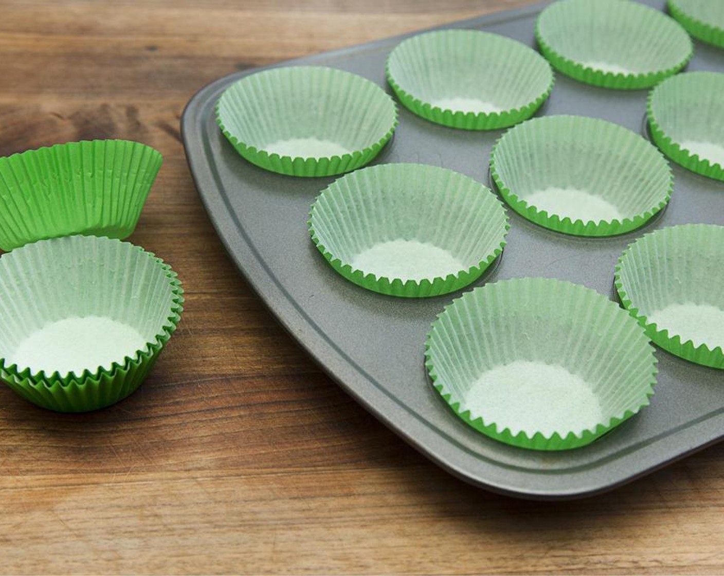 step 2 Line muffin tin with muffin cups.