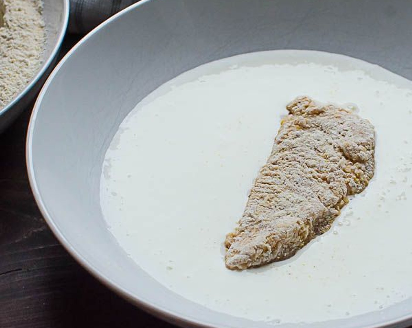 step 7 Working in batches, dip chicken strips in buttermilk, then into flour mixture, back into the buttermilk and finally into the flour mixture.