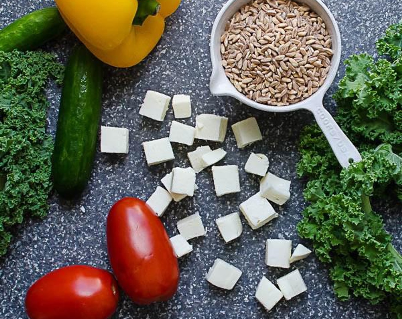 step 2 Meanwhile, place the Kale (4 stalks), on a cutting board and massage them firmly with your hands, kneading the leaves until they smell fresh and grassy. Ball the kale into a tight ball and thinly slice the kale with a sharp knife.