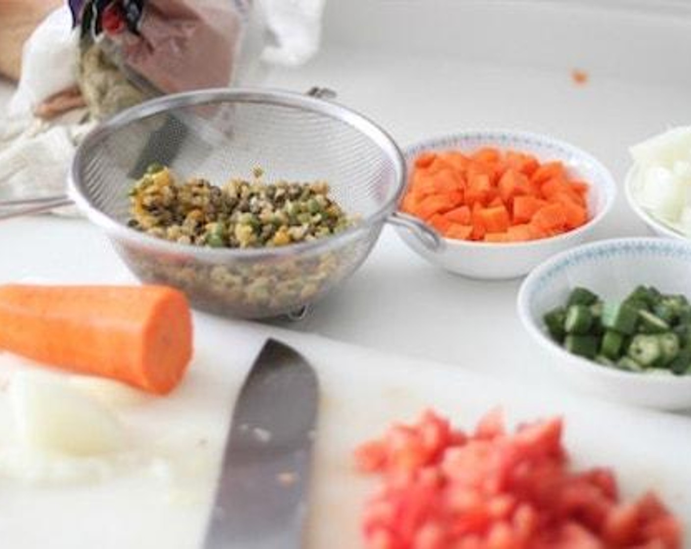 step 4 Cut the Mushrooms (6), Tomatoes (3), Carrot (1), Garlic (2 cloves), Onion (1) into small pieces and boil the Lentils (1 1/2 cups) for 15 minutes and strain. Prepare the  Vegan Red Wine (1/2 cup), Canned Tomato Purée (1/2 cup), and Vegetable Stock (1 cup).