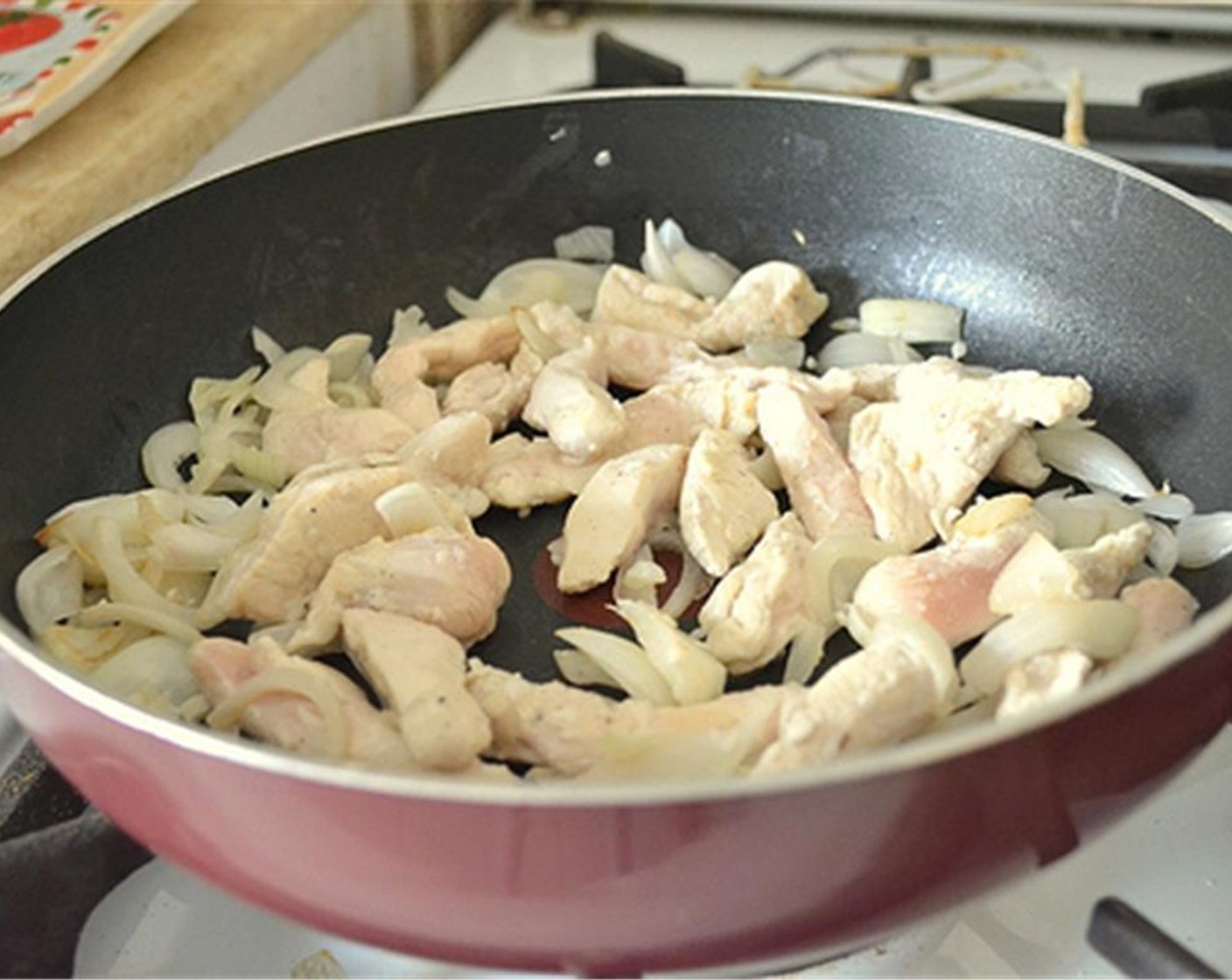 step 5 Add the chicken strips and stir fry until no longer pink.