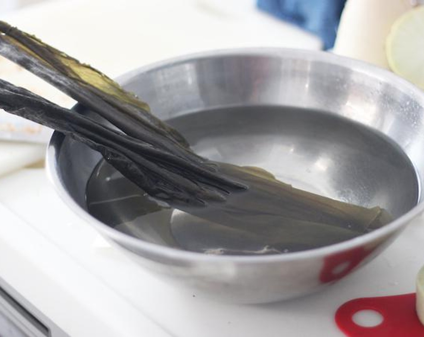 step 5 Take your dried Kombu (1 sheet) out, and let it sit for 5 minutes in water.