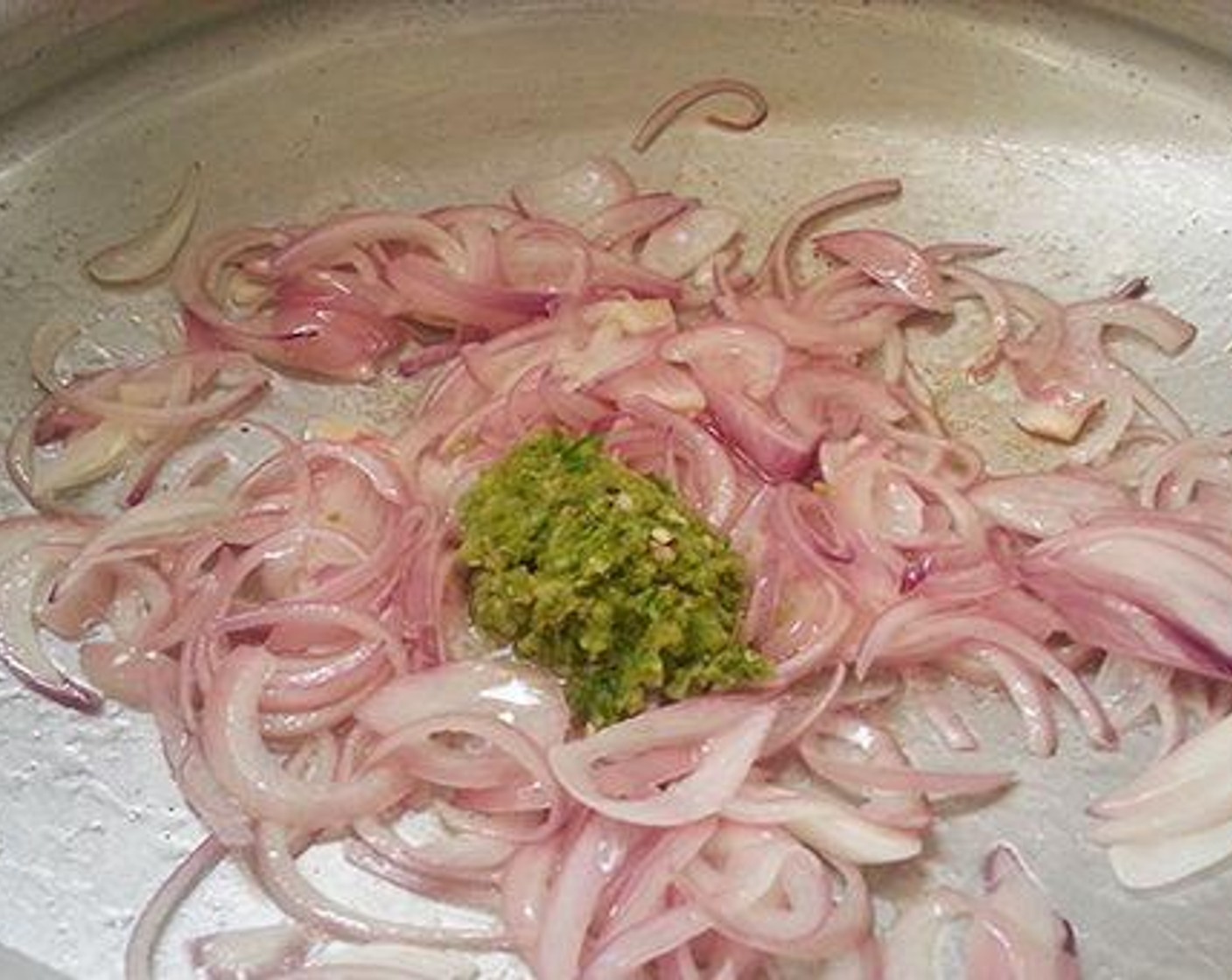 step 2 Pour Coconut Oil (3 Tbsp) to a pan and add Onion (1) and saute till onion becomes soft. Then add Fresh Ginger (1), Garlic (4 cloves), Green Chili Peppers (2) and saute for a good 4 to 5 minutes in low flame.
