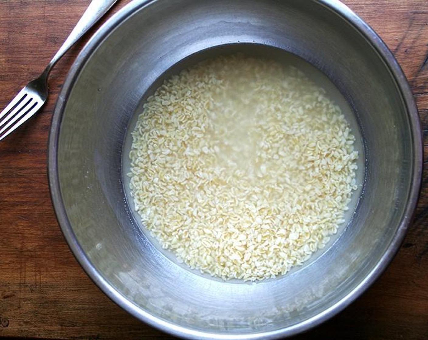 step 1 Place Bulgur Wheat (1 cup) in a large bowl. Cover with cold water. Let stand for one hour. Drain in a fine-mesh sieve or use a pot cover to hold back the bulgur while you drain the water into the sink. Set aside.