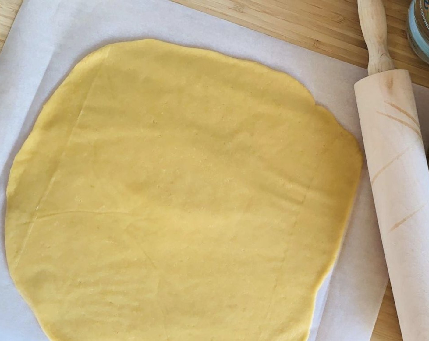 step 5 When the crust is ready, roll it out and use it to cover the bottom and sides of an 8-inch springform pan lined with parchment paper.