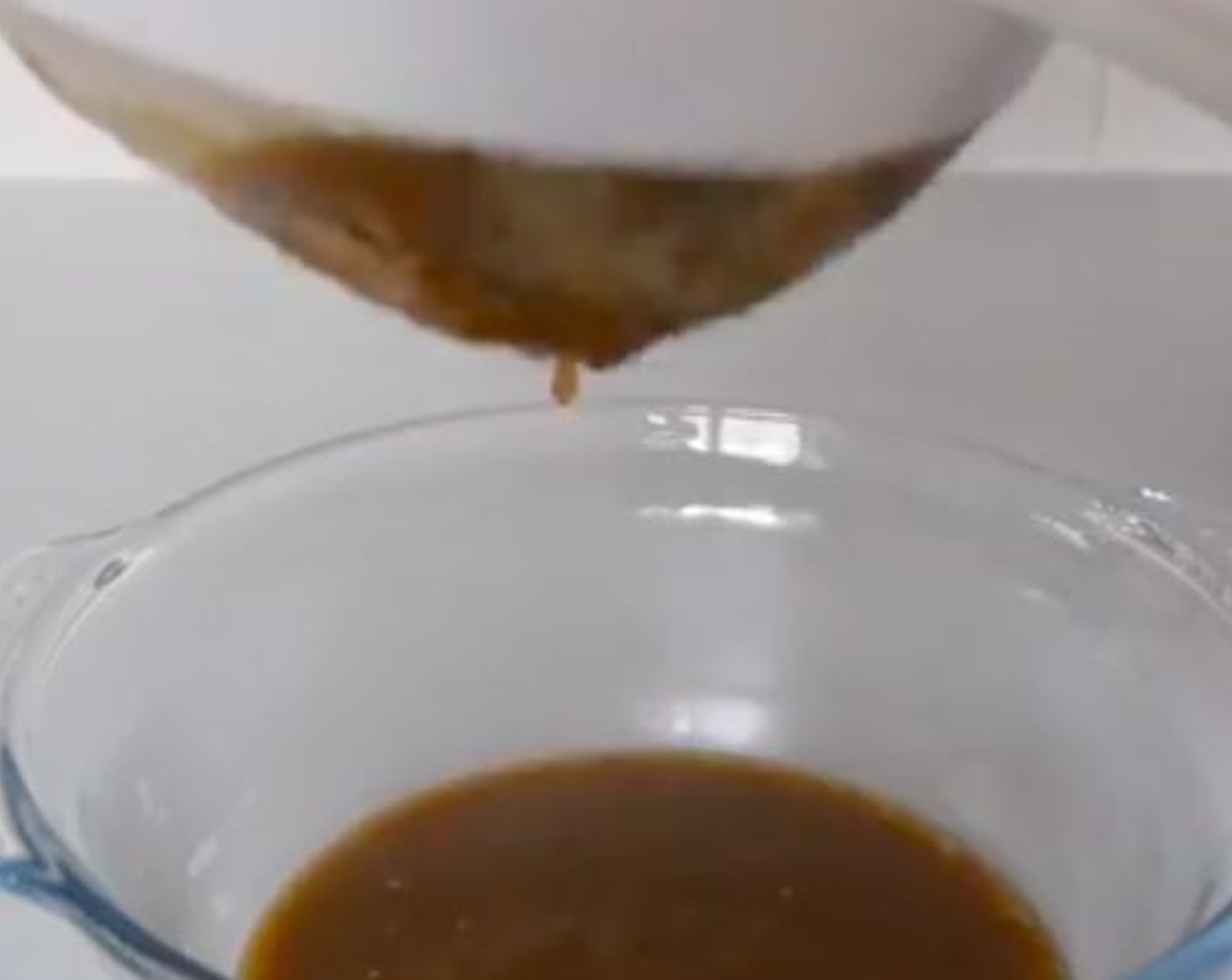 step 10 After, pass the gravy through a sieve or fine colander to remove all large bits and finish with a smooth gravy.