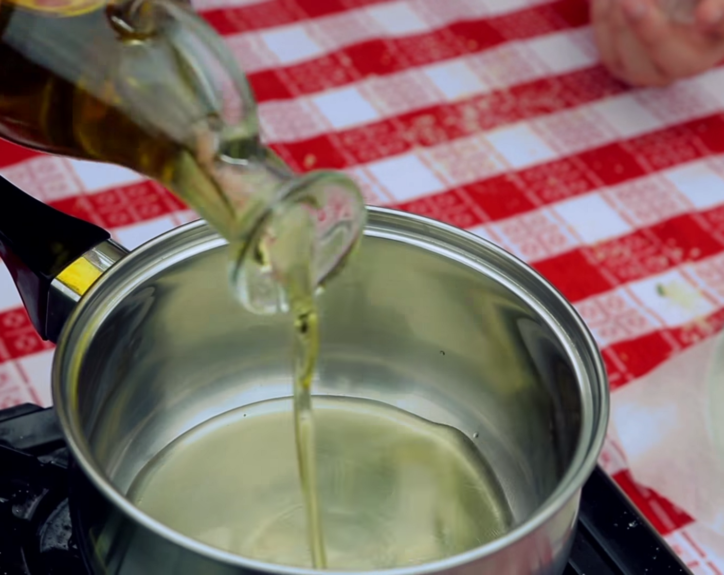 step 8 To prepare for cooking your cheese balls, put a frying pan on the stove and fill it with Extra-Virgin Olive Oil (as needed), warming it up to 266 degrees F (130 degrees C).