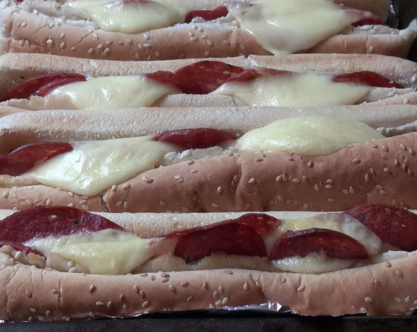 step 6 Place baking tin in the oven and allow to cook for about 10 minutes or until cheese has melted.