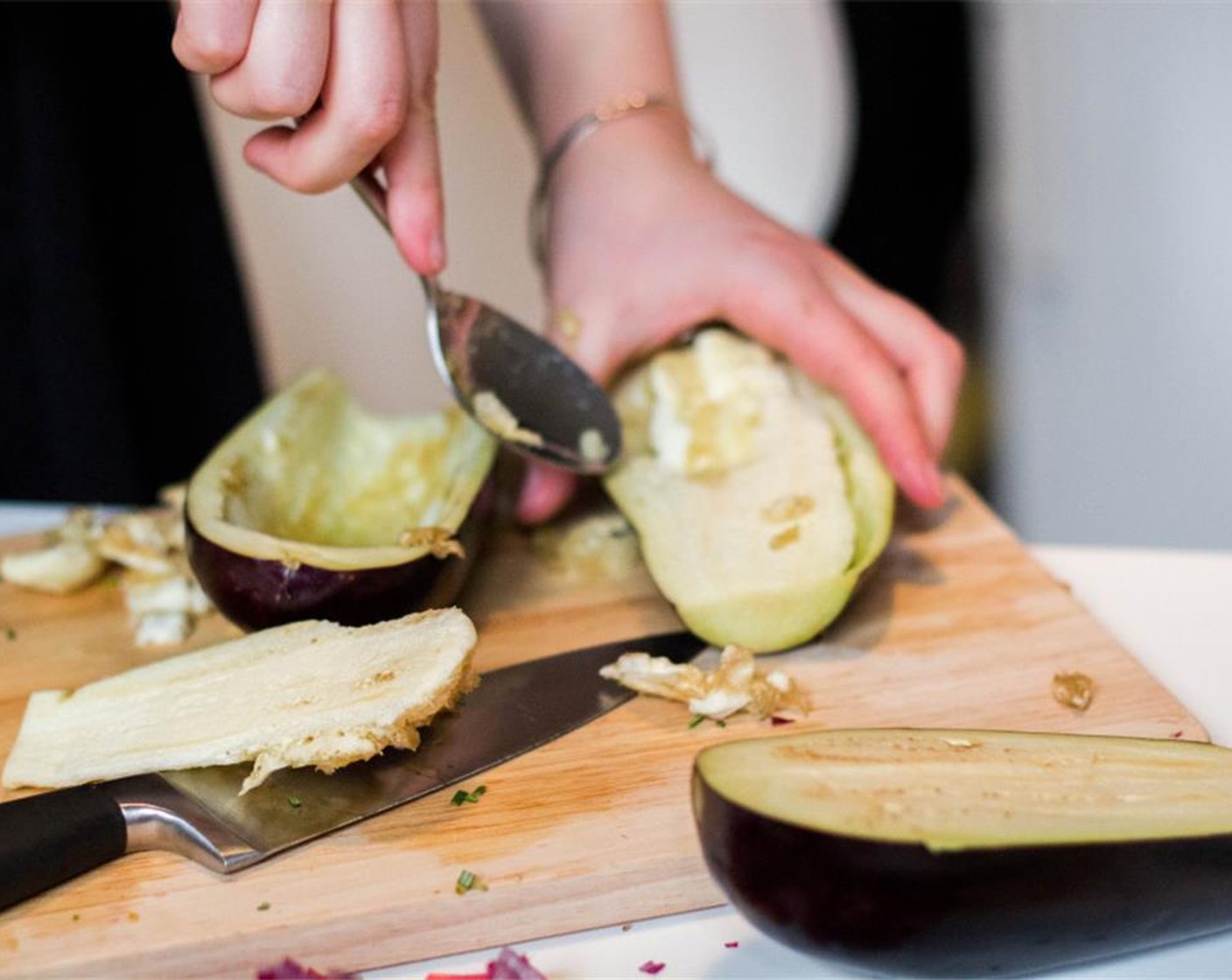 step 1 For hollowing out the Eggplants (2), take a spoon and scoop out the flesh bit by bit.