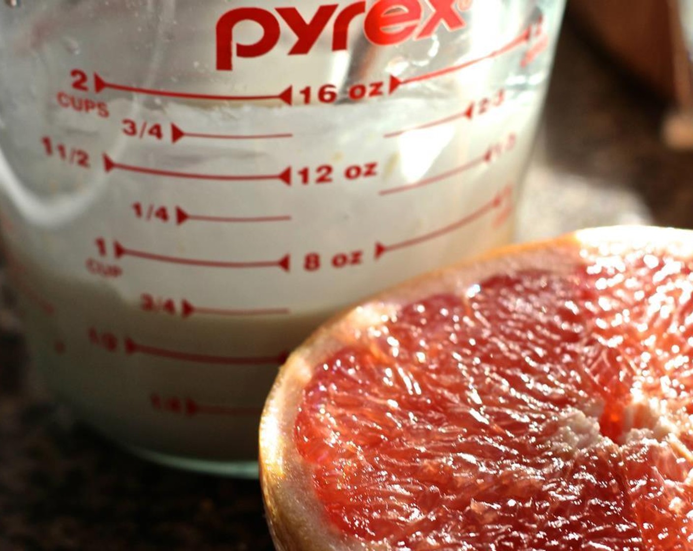 step 9 While the cakes cool, prepare the glaze: in a small bowl, whisk together the Powdered Confectioners Sugar (1 1/4 cups), Fresh Grapefruit Juice (1 Tbsp), and Vanilla Extract (1 tsp). Add the Milk (1 Tbsp) a little bit at a time until the mixture is smooth but not too thin.